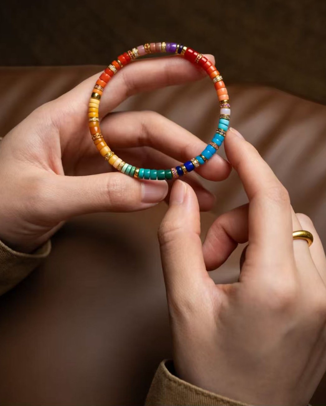 Rainbow harmony bracelet held in hands