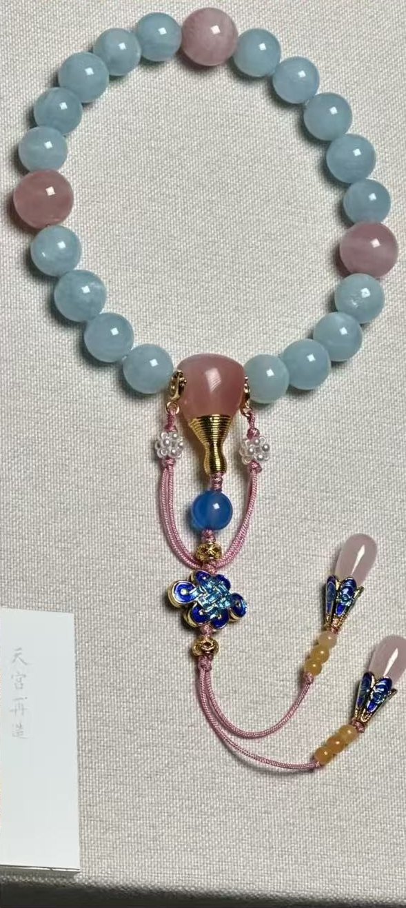 Blue and pink beads with cloisonne knot