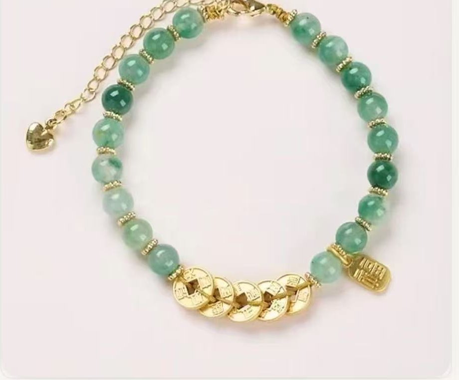 Green jade bracelet with gold emperor coins