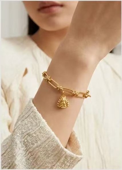 Gold link bracelet on wrist
